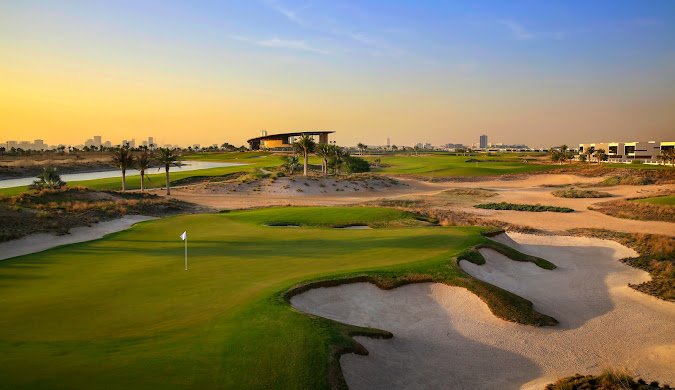 Luxurious Trump International Golf Club with expansive green fairways, sand bunkers, and a modern clubhouse, set against a backdrop of palm trees and a bright sky.